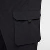 Close-up of a NIKE SB KEARNY CARGO SKATE PANTS BLACK pocket with a flap closure, highlighting the stylish design and robust craftsmanship of these nike pants.