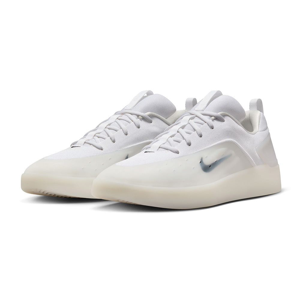A pair of NIKE SB NYJAH 4 WHITE / BLACK-WHITE-BLACK skate shoes by Nike, featuring white uppers, translucent rubber soles, and grey Swoosh logos, displayed on a plain white background for lightweight everyday durability.