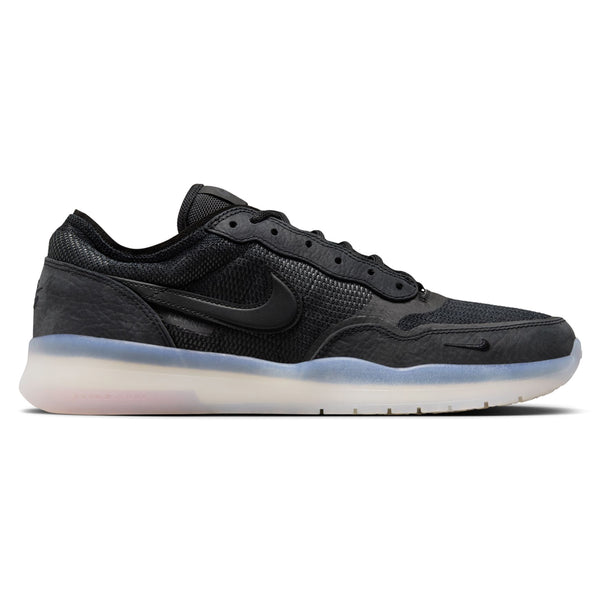 The NIKE SB PS8 BLACK/BLACK-BLACK-BLACK is a black athletic shoe featuring a textured design, a black Nike swoosh logo on the side, Flyknit construction for a snug fit, and a semi-transparent white sole with Air Zoom cushioning for superior comfort.