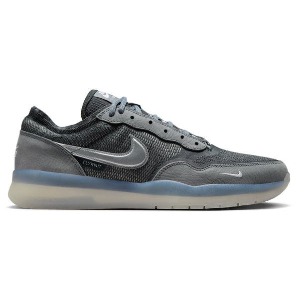 Introducing the NIKE SB PS8 in Cool Grey/Metallic Silver, featuring Flyknit construction with a prominent white Nike swoosh logo and a translucent sole.