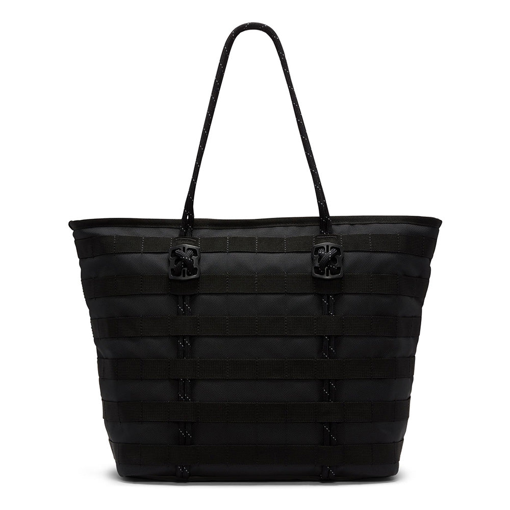 The NIKE RPM TOTE (26L) BLACK by Nike is a spacious recycled polyester tote featuring two shoulder straps and a stylish, textured horizontal stripe design for added durability.