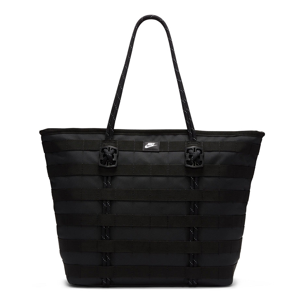 The NIKE RPM TOTE (26L) BLACK is a durable, large tote bag with double handles, horizontal woven details, and a small Nike logo. Made from recycled polyester, it's ideal for daily use and fits your laptop comfortably.