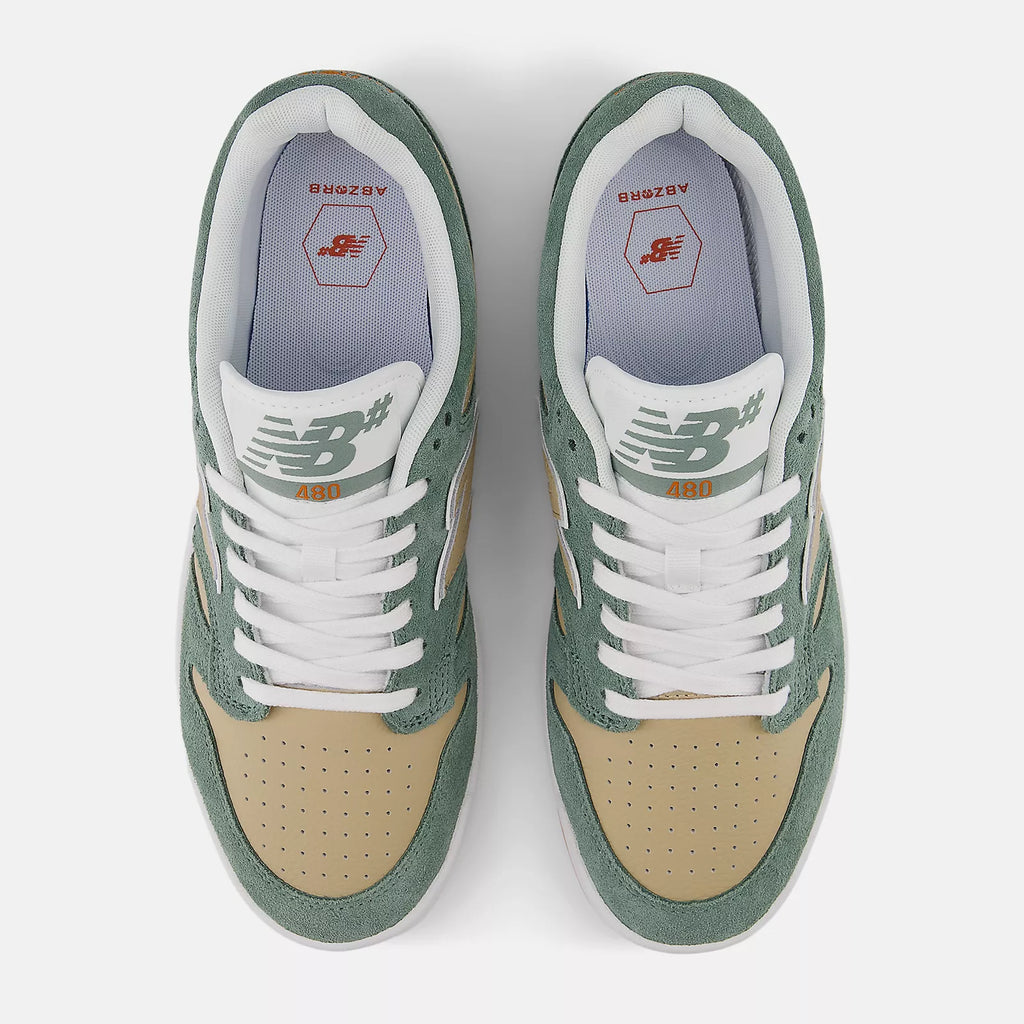 A pair of NB NUMERIC 480 SUEDE GREEN / WHITE sneakers in green and tan.