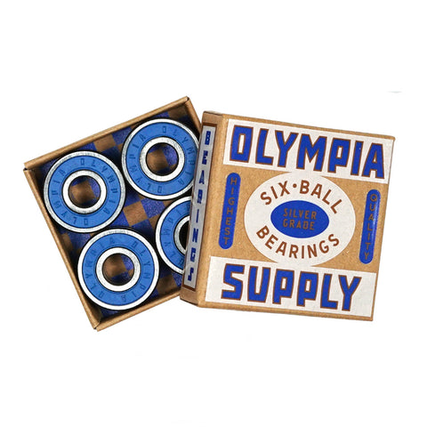Open OLYMPIA SUPPLY SILVER GRADE SIX-BALL BEARINGS box with precision steel balls, showing four blue bearings.