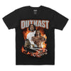 A black STANCE X OUTKAST TEE BLACK, by STANCE, featuring two men above a burning car with the word "OUTKAST" in large, bold letters at the top.