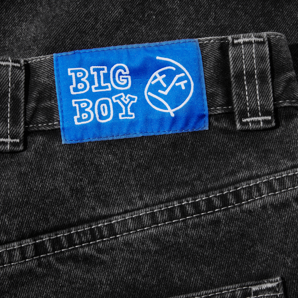 A patch of POLAR BIG BOY SILVER BLACK on the back of a pair of jeans by POLAR.