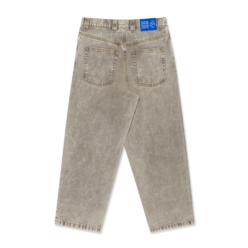 Rear view of acid beige, baggy fit cropped jeans featuring a blue patch on the waistband. Two back pockets are visible, epitomizing the relaxed style of POLAR BIG BOY JEANS.