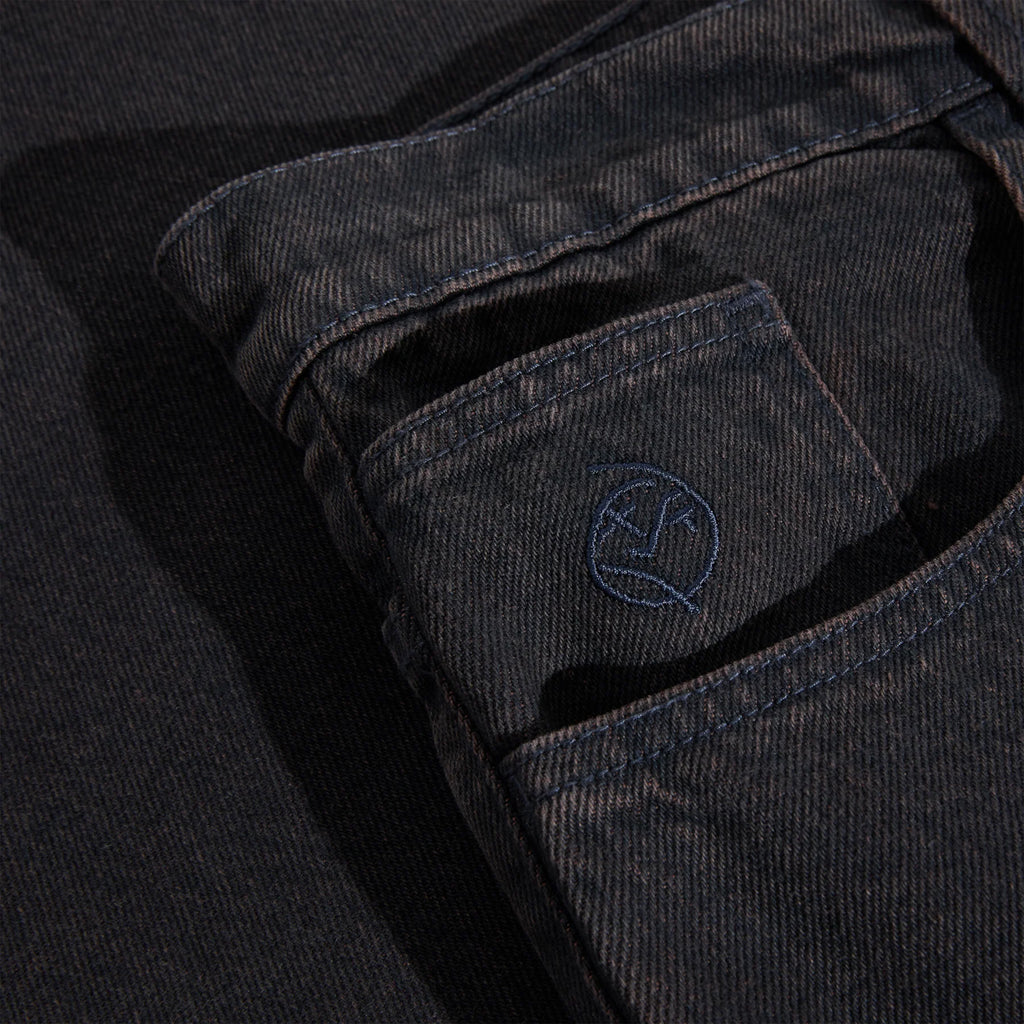 Close-up of the high-waisted pocket on the POLAR BIG BOYS BROWN BLUE black denim, featuring a subtle embroidered POLAR logo design in navy blue thread on the outer fabric.