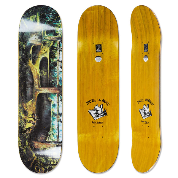 Three skateboard decks from Polar: one decorated with a forest scene and two showcasing yellow woodgrain. Each features a graphic of a hand holding a mouse alongside the text "Eagles Laurent." These decks embrace the Spiral of Life theme, enriched by Tynan Kerr's artwork, reflecting inspiration from Polar Shin Sanbongi designs. The product is named POLAR EMILE LAURENT BURNSIDE 2084.