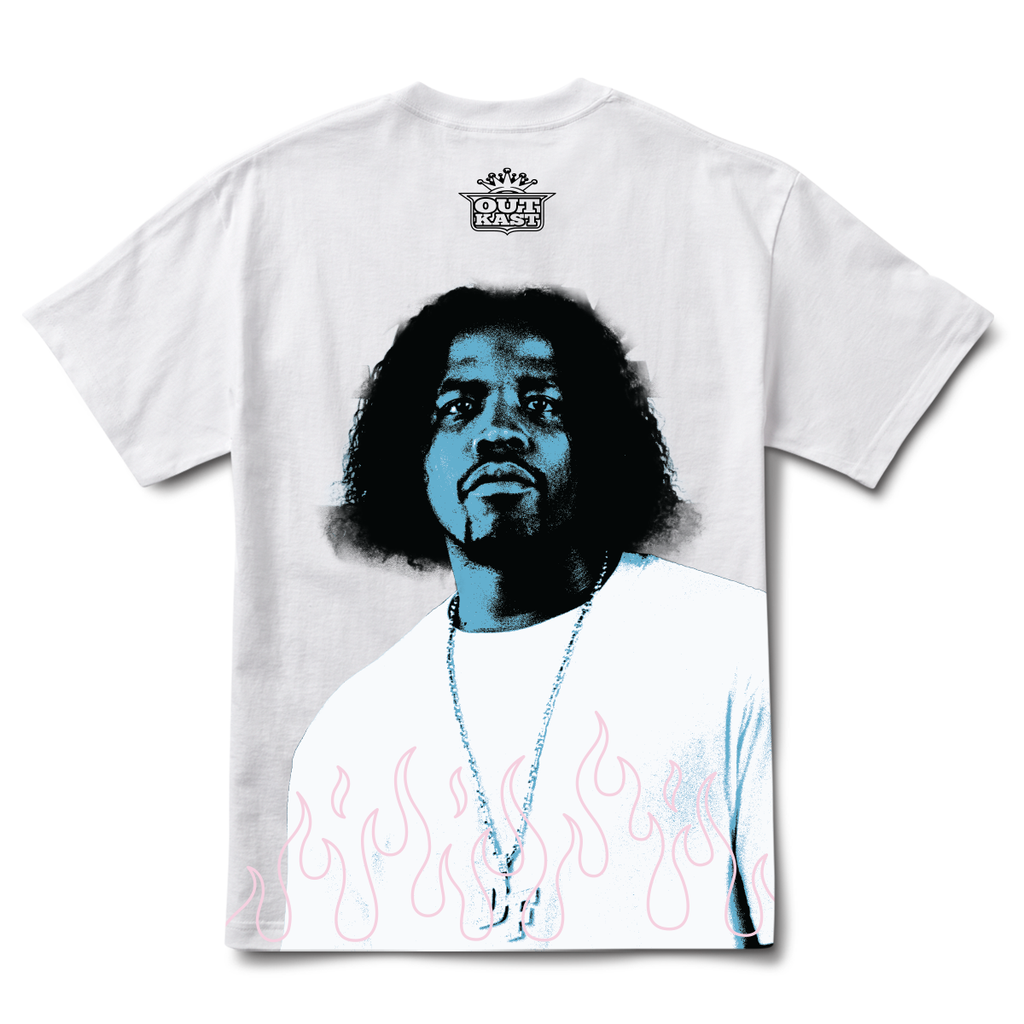 The PRIMITIVE X OUTKAST DYNAMIC TEE WHITE showcases a blue-tinted illustration of a person wearing a necklace with dynamic flame graphics, and the "Out Kast" logo.