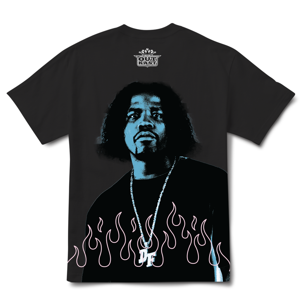 The PRIMITIVE X OUTKAST DYNAMIC TEE BLACK showcases a striking graphic of a person wearing a necklace, surrounded by flames, and features bold "OutKast" text at the top. This Naruto-inspired tee from PRIMITIVE is perfect for fans and collectors.