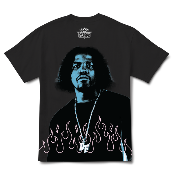 The PRIMITIVE X OUTKAST DYNAMIC TEE BLACK showcases a striking graphic of a person wearing a necklace, surrounded by flames, and features bold "OutKast" text at the top. This Naruto-inspired tee from PRIMITIVE is perfect for fans and collectors.