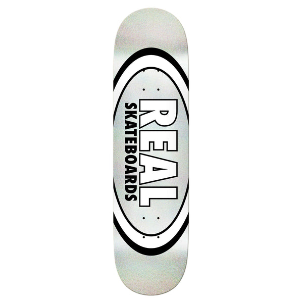 A REAL OVAL EASY RIDERS WHITE skateboard deck displaying the brand "REAL" in bold, black text within an oval design, featuring a relaxed concave for enhanced control.