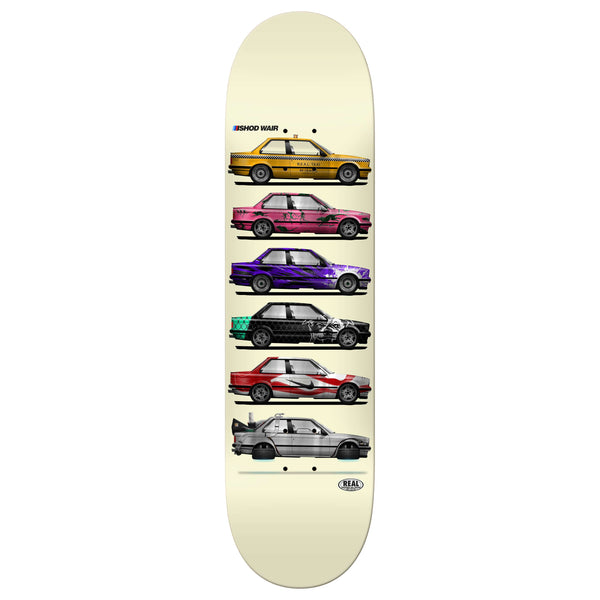 The limited edition REAL ISHOD SKATESHOP DAY BLIND BAG TT skateboard deck features six classic car illustrations in vibrant colors on a light background, ideal for any collector or fan of the Ishod Skateshop.