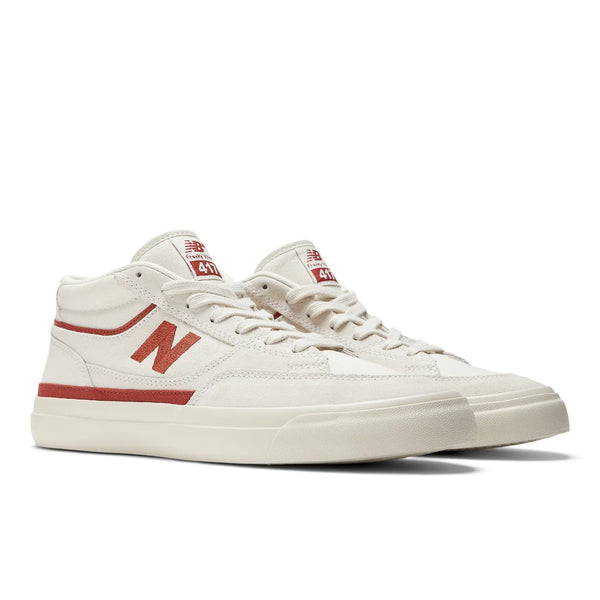 A white and red NB NUMERIC 417 VILLANI sneaker with secure fit.
