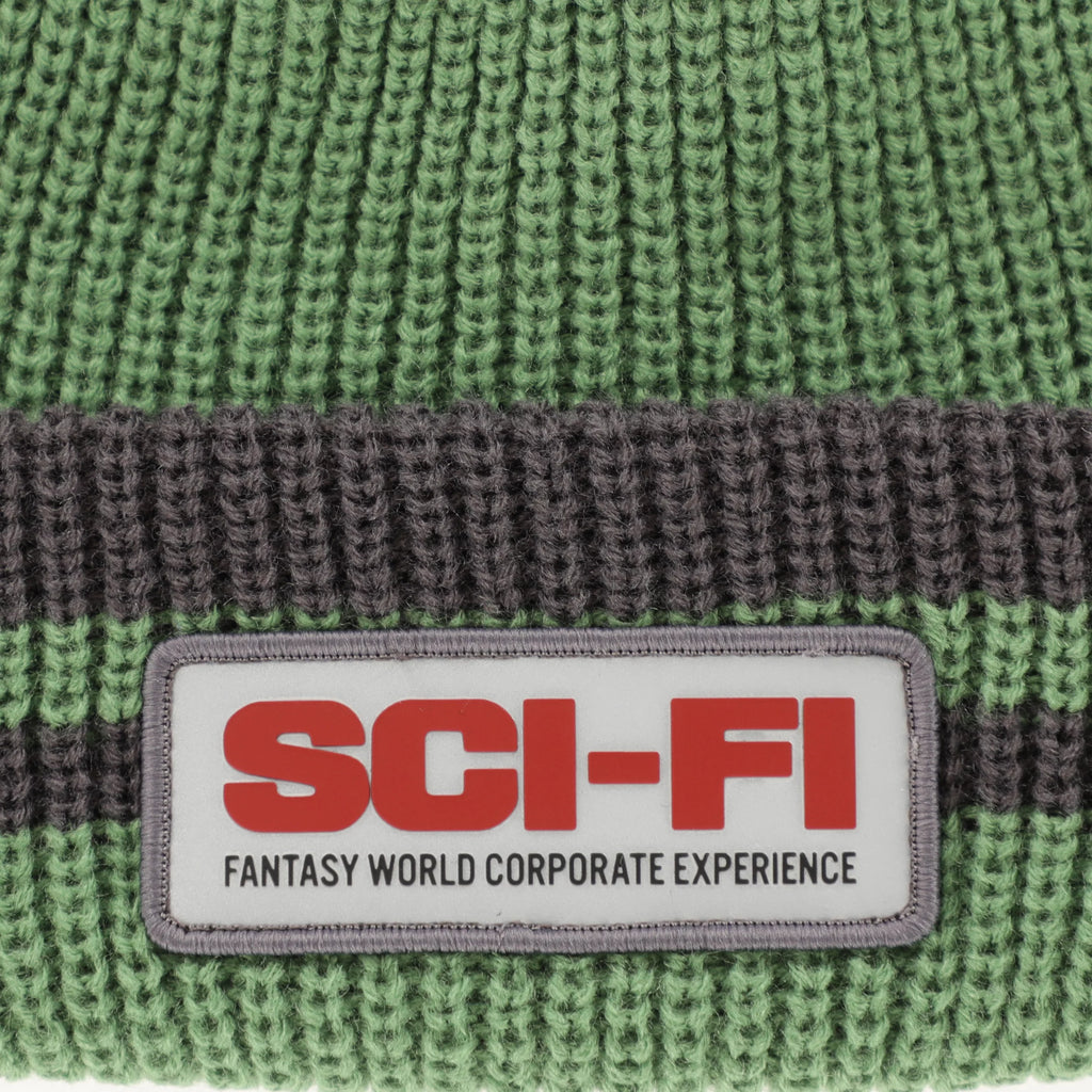 A SCI-FI FANTASY REFLECTIVE PATCH STRIPED BEANIE OLIVE/GREY with the word sci-fi on it.