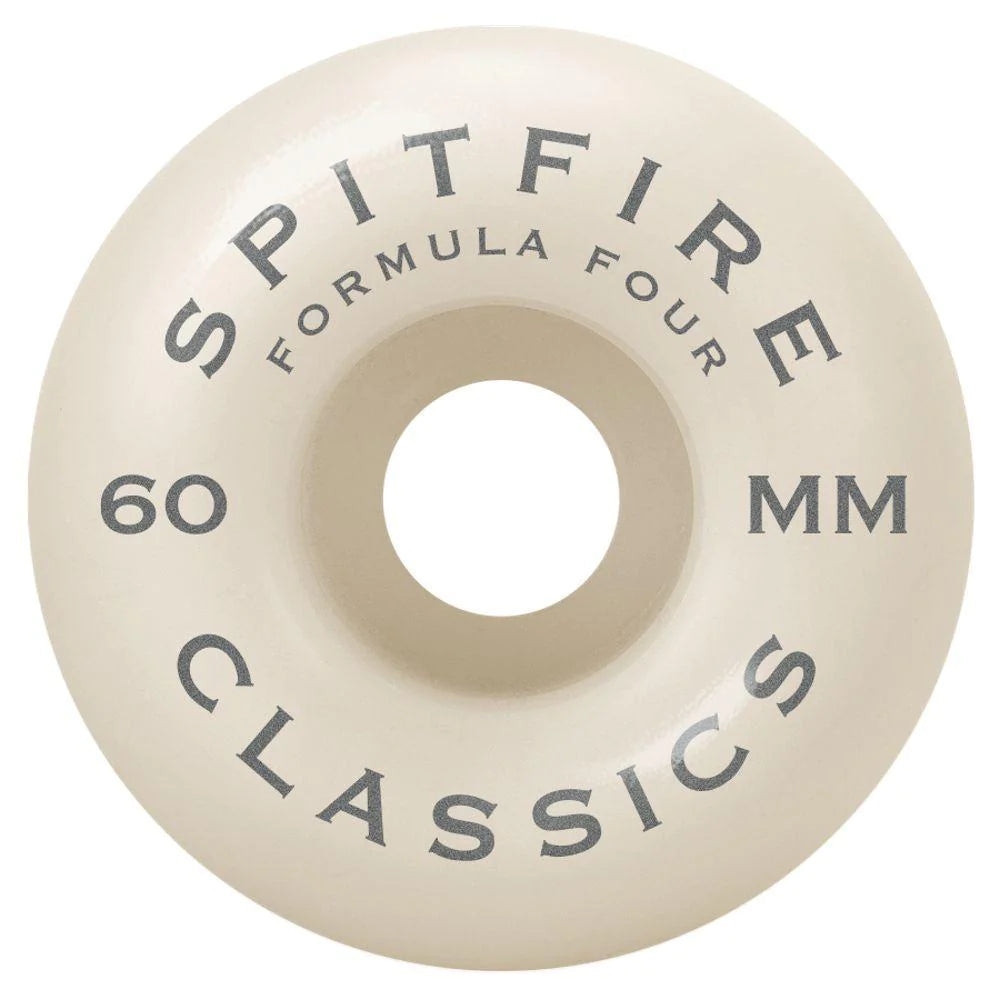 A SPITFIRE F4 CLASSICS 99D 60MM RED/BRONZE skateboard wheel with SPITFIRE lettering on it.