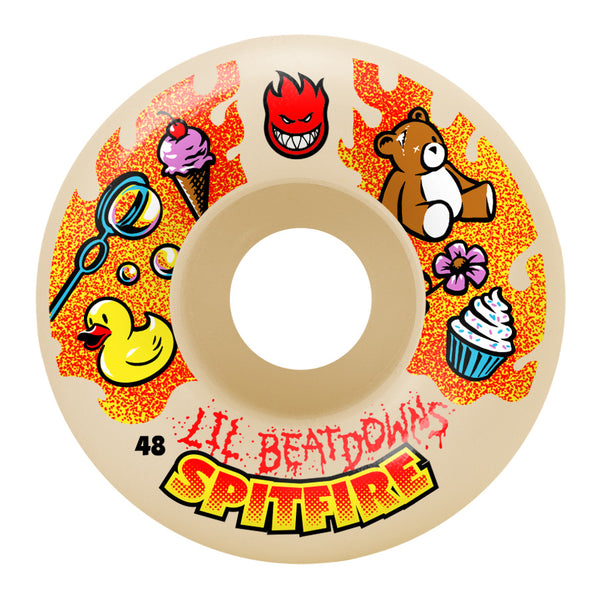 A SPITFIRE skateboard wheel with an image of a bear and teddy bear, designed using FORMULA FOUR technology.