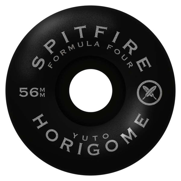 Close-up of a SPITFIRE F4 Yuto Cherry Blossom Classics 99D skateboard wheel in black, featuring the text "Formula Four" and "Yuto Horigome," along with a stylized logo. The 56mm diameter is prominently displayed, embodying the unique style of Yuto Cherry Blossom.