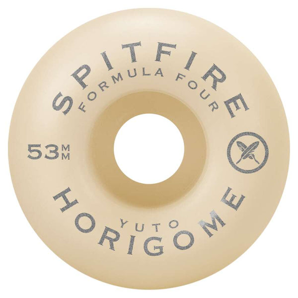 Close-up of a beige skateboard wheel featuring the text "Spitfire F4 Yuto Cherry Blossom Classics," "53mm," and "Yuto Horigome" in black, emphasizing the smooth ride of the 99D wheels.