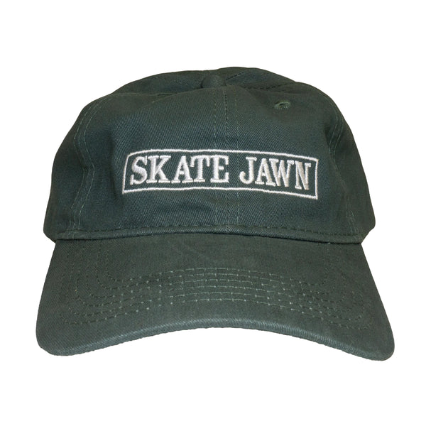 A SKATE JAWN 6-panel green hat with the word skate jawn on it.