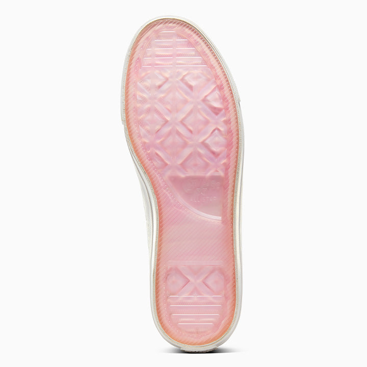 A pair of CONVERSE x TURNSTILE ONE STAR PRO OX WHITE / PINK skateboarding shoes with pink soles.