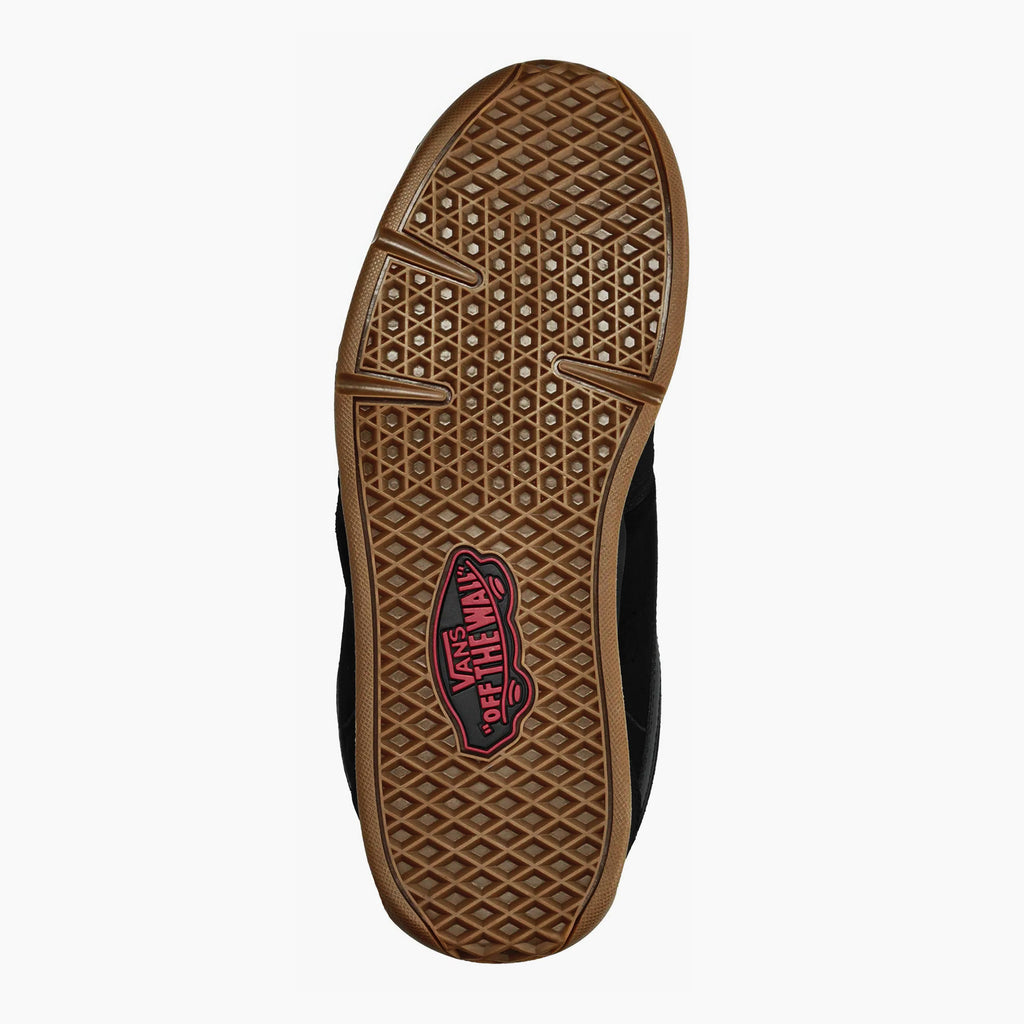 Sole of a black VANS Rowley XLT skate shoe with a brown, waffle-pattern tread and a red rectangular logo in the center.