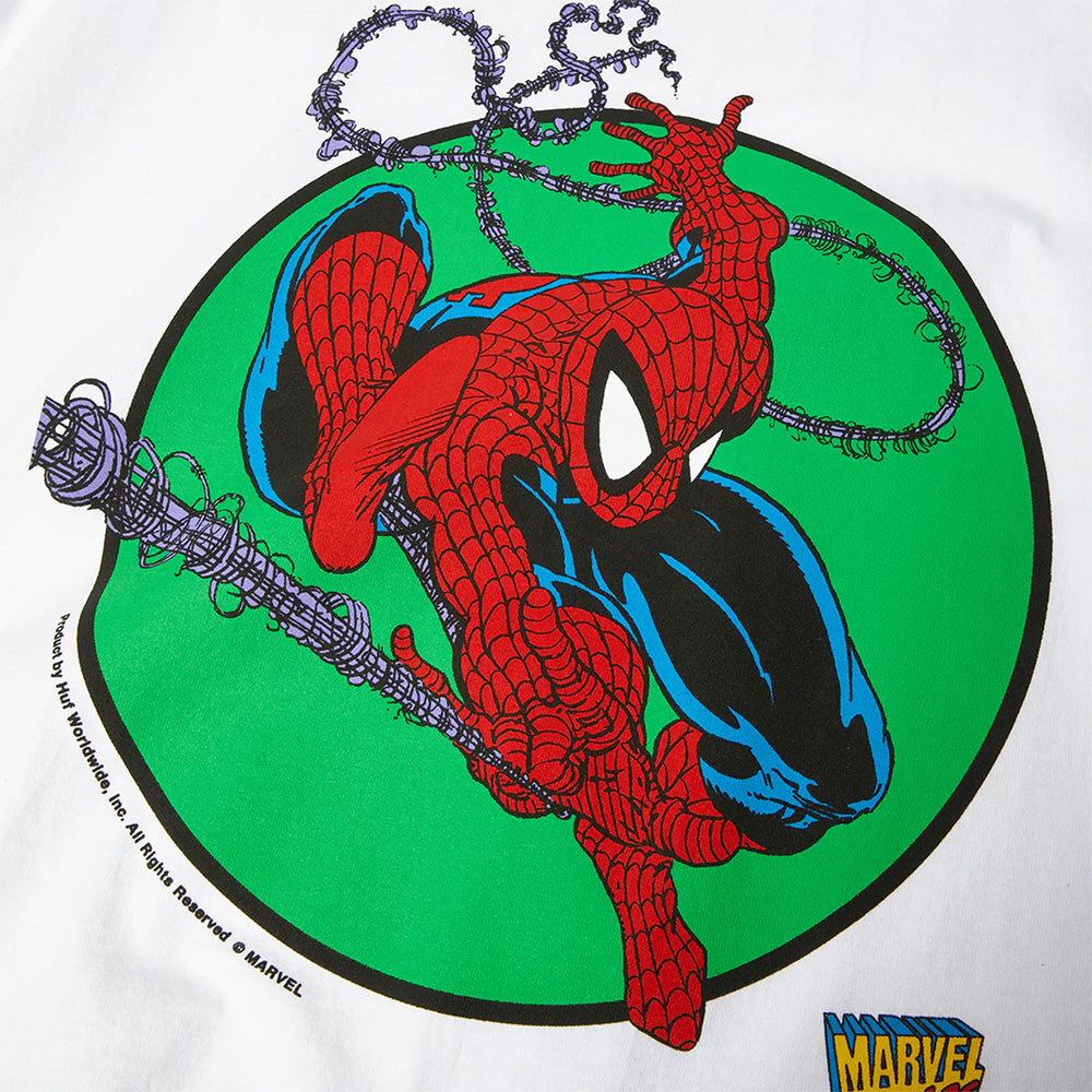 The HUF X MARVEL SPIDER-MAN THREE HUNDRED TEE WHITE features Spider-Man swinging on a web against a green circle, with a Marvel logo in the bottom right corner. This cotton short sleeve tee is part of the HUF x Marvel collection.