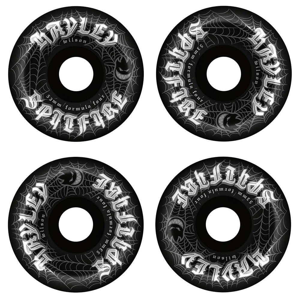 Set of four SPITFIRE HAYLEY WEBBED CONICAL FULL 99D 53MM BLACK skateboard wheels, featuring white spiderweb and jack-o'-lantern graphics with "Spitfire" and "Wilsons" in gothic lettering on the edge.