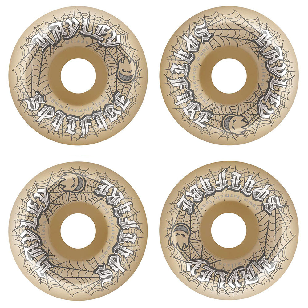 The SPITFIRE F4 HAYLEY WEBBED CONICAL FULL 99D 56MM wheels feature tan urethane with black spiderweb and pumpkin face graphics plus stylized "Spitfire" lettering—offering skaters style and reliable performance.