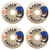 Four SPITFIRE F4 KARIM BURN SQUAD RADIAL FULL 97D 58MM skateboard wheels are arranged in a square, each featuring bold text, a cartoon face with a blue hat, and red graphic details.