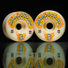 Two SPITFIRE F4 CHROME VENOM CONICAL FULL 99D 54MM skateboard wheels with flame graphics are displayed on a reflective black surface.