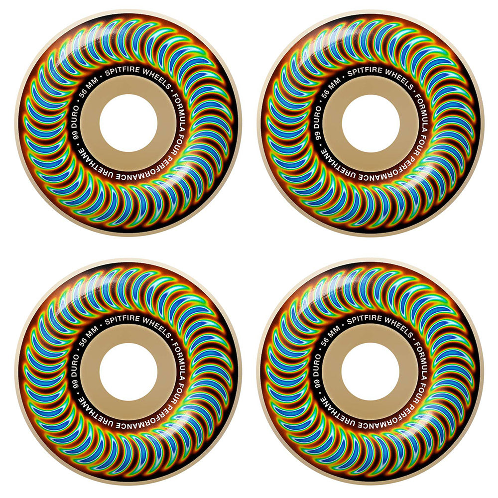 Four vibrant skateboard wheels with a swirling rainbow pattern and "SPITFIRE F4 RADIOACTIVE CLASSIC 99D 56MM" text around the center, by SPITFIRE.