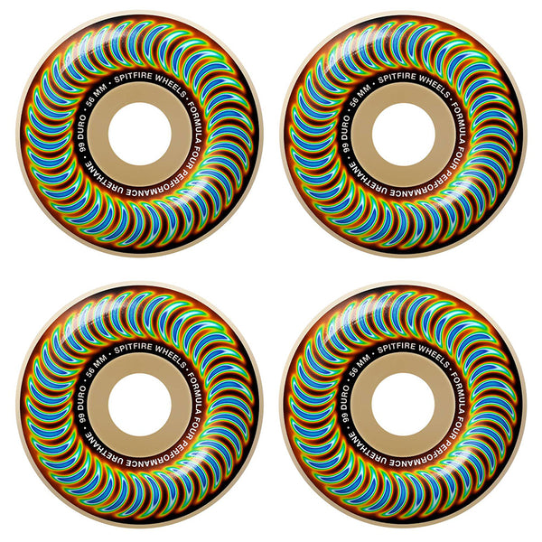 Four vibrant skateboard wheels with a swirling rainbow pattern and "SPITFIRE F4 RADIOACTIVE CLASSIC 99D 56MM" text around the center, by SPITFIRE.