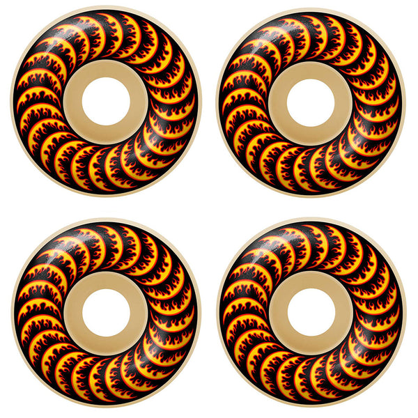 Four SPITFIRE X THRASHER F4 FLAME CLASSICS 99D 52MM skateboard wheels with a tan base and black-red flame design are displayed in a two-by-two grid, blending classic FORMULA FOUR style with THRASHER-inspired graphics.