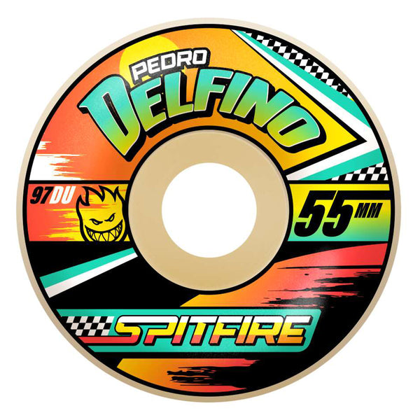 An eye-catching SPITFIRE skateboard wheel named "SPITFIRE F4 DELFINO TURBO RADIALS 97D 55MM" features vibrant graphics embodying Pedro Delfino's iconic style. Showcasing a flame design that represents the Skate Girl Evolution spirit, this wheel measures 55mm in diameter and has a hardness rating of 97DU.