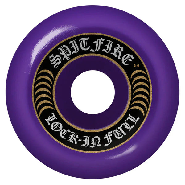 SPITFIRE F4 LOCK IN FULL 99D 54MM PURPLE skateboard wheel with the text "Spitfire Lock-In Full" and "54" on the side. This 54mm wheel features a black inner ring, gold accents, and is crafted using the Spitfire Formula Four for superior performance. Its 99 DURO hardness ensures a perfect balance of control and speed.