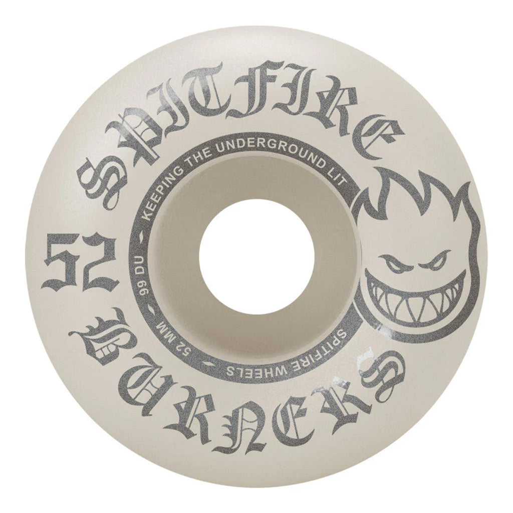 The SPITFIRE BURNERS 99D 52MM skateboard wheel by SPITFIRE is a white wheel with "Spitfire Burners" text and a graphic of a grinning flame face. This entry-level wheel features a durable 99 Duro hardness and measures 52 mm, making it ideal for both beginners and pros. Additionally, the text "Keeping the underground lit" enhances its appeal.