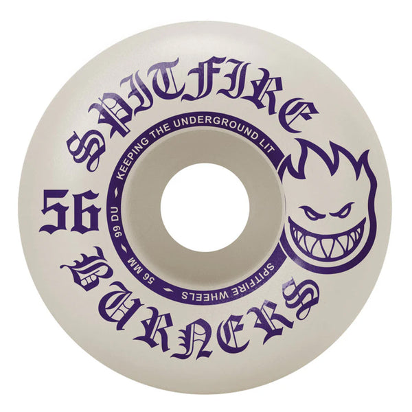 A white skateboard wheel branded SPITFIRE, measuring 56mm with a durometer of 99, features purple text reading "Spitfire Burners 56mm 99 DU." It showcases a flame-head logo and the tagline "Keeping the Underground Lit," making it an excellent option for entry-level skaters aiming to enhance their ride.