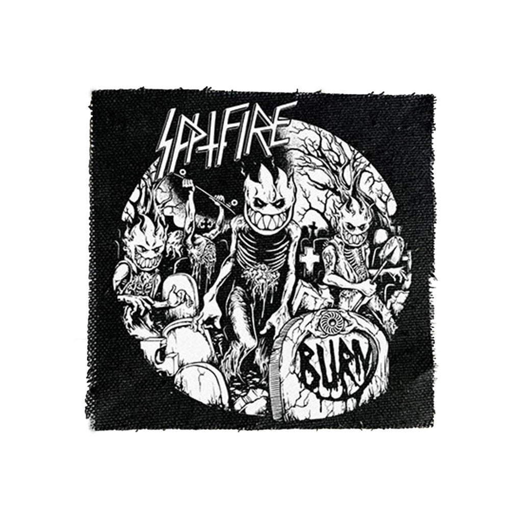 Black and white graphic design featuring a central ghoulish character with "SPITFIRE F4 GRANT UNDEAD 99D 57.5MM" text, surrounded by similar figures and "Burn" written on a tombstone.