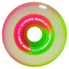 A neon-colored skateboard wheel with "SPITFIRE SAPPHIRES 90D 56MM PINK / GREEN" text printed on it, featuring the iconic Venom Script and blending pink, green, and white hues in a gradient pattern.