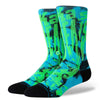 Brightly colored STANCE X OUTKAST ATLIENS CREW SOCKS LARGE featuring a bold, abstract design in green and blue with black accents, offering light cushioning and arch support for all-day comfort.