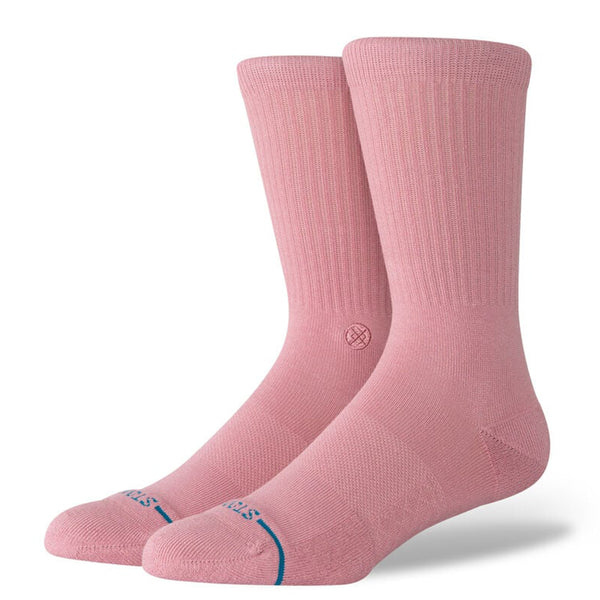 These STANCE SOCKS ICON DUSTY ROSE showcase a unique logo near the ankle, harmoniously blending with their pink shade. The crew height design and blue lettering on the toes enhance any ensemble with a stylish flair.