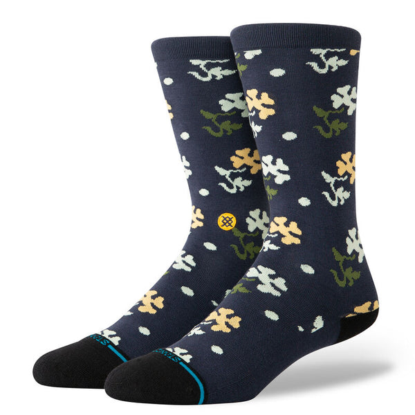 A pair of navy blue cotton crew socks with a floral pattern in white, yellow, and green from STANCE called STANCE SOCKS POP END NAVY LARGE.