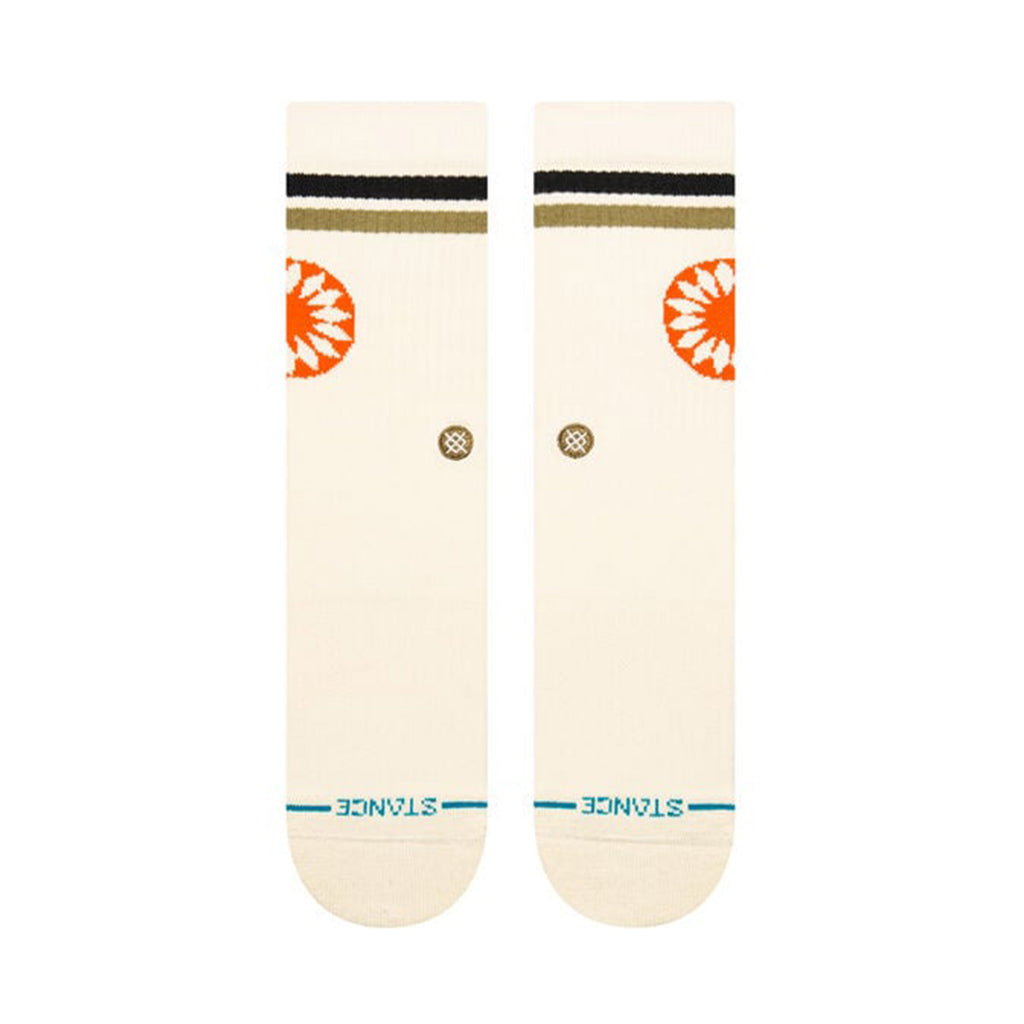 A pair of STANCE SOCKS SUN DIAL CREAM LARGE in white with blue toe lines, featuring a black, dark green, and orange circular design. Crafted as a Cotton Crew with added arch support for comfort, they proudly display the brand name "STANCE" at the bottom.