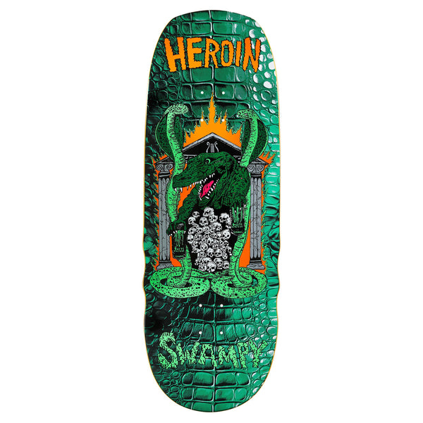 The HEROIN SWAMPY KNOCK OFF skateboard deck is 10.6", made from North American Hard Rock Maple, and features a green crocodile with skulls, reptile-textured skin, and bold HEROIN branding for an edgy style.