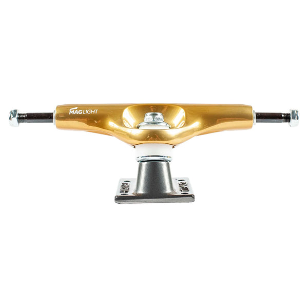 The ollie's TENSOR MAG-LIGHT GLOSSY 5.5 GOLD/GUN METAL skateboard trucks (set of two) feature lightweight magnesium construction and a hollow axle, shown in glossy gold and gun metal against a white background.
