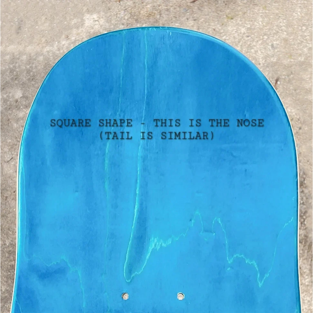The TEST BEHOLDER 3 SQUARE SHAPE skateboard by TEST features a blue deck with the test logo in black text, a distinctive square nose and tail, and is available in tan/brown colors and sizes 8.125 & 8.625.