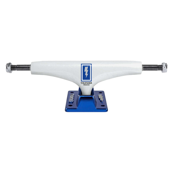 White skateboard truck with a blue forged baseplate, adorned with the Thunder logo, and designed using Hollow Lights technology for a lightweight ride. Known as the THUNDER TRUCKS HOLLOW LIGHTS BOXED BOLTS POLISHED 148 (SET OF TWO) by Thunder.