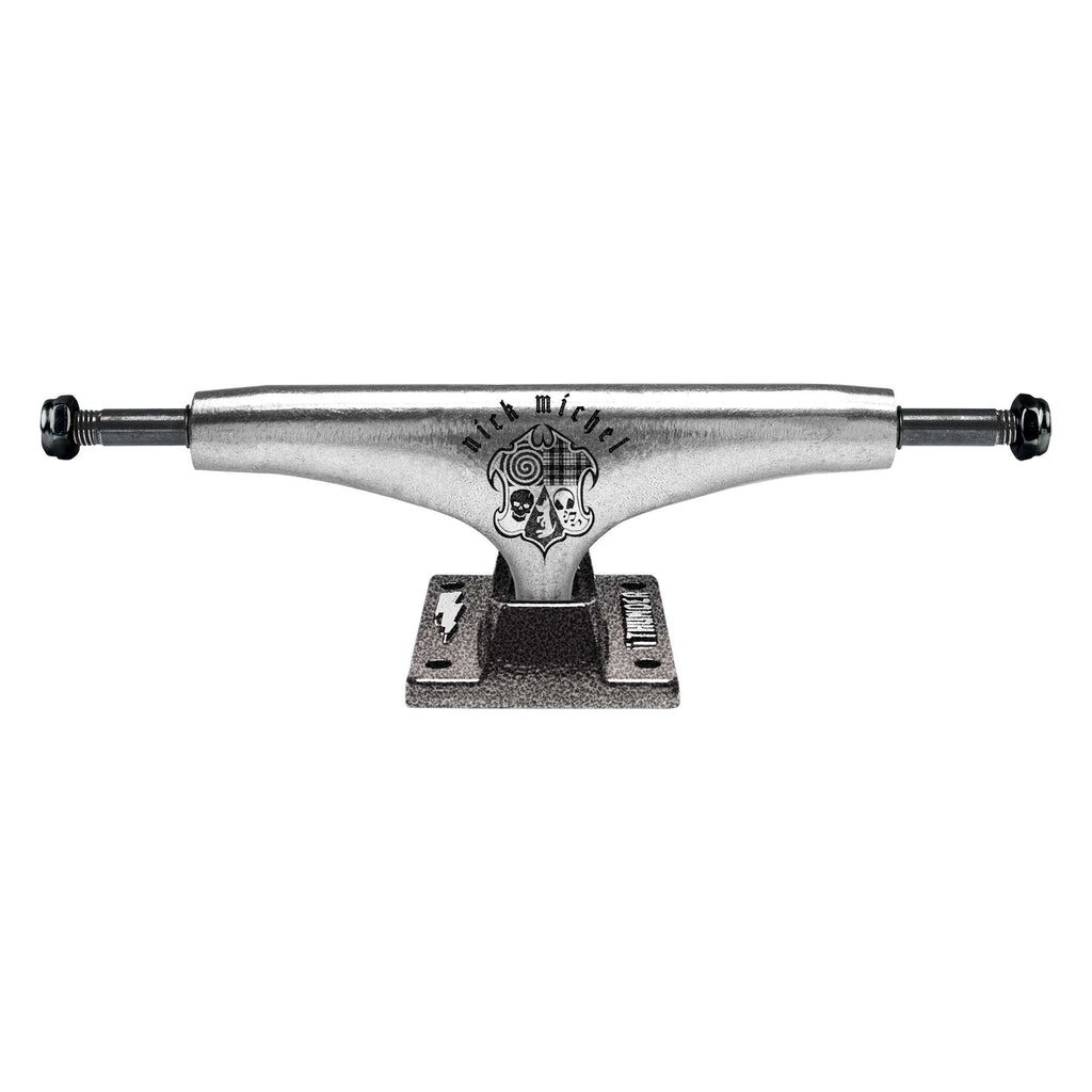 A THUNDER TRUCKS NICK MICHEL EMBLEM 149 skateboard truck set, showcasing a brushed metal finish with intricate engraving, viewed from the front, inspired by Nick Michel.